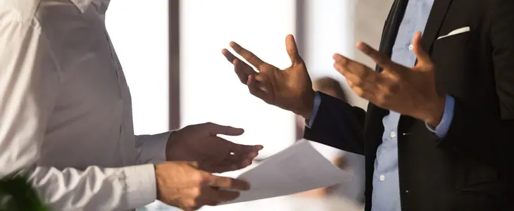 Two businessmen having a business dispute at their office