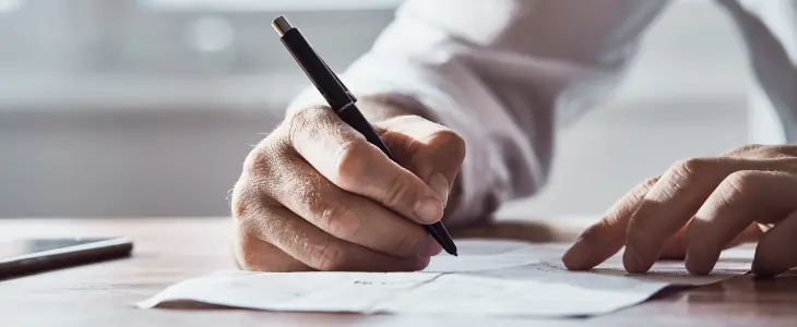 Man signs a contract