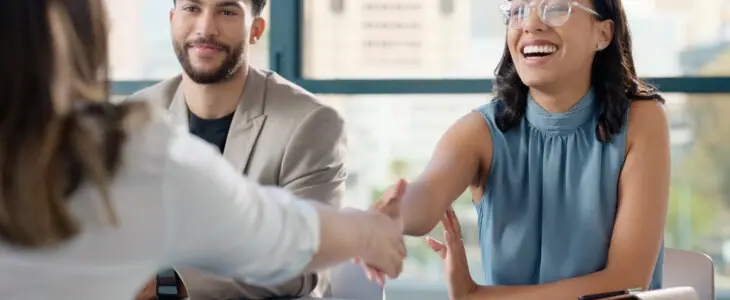 Happy business people, contract or shaking hands for recruitment, collaboration or teamwork. Handshake, partnership or proud employees in corporate agreement for meeting success, welcome or thank you